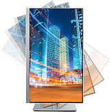 Refurbished The monitor displays a nighttime cityscape, showcasing towering skyscrapers and blurred motion effects that simulate light