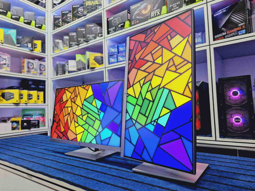 Refurbished HP EliteDisplay E243 FHD 24 HDMI Monitor with vibrant, multicolored LED display and speaker grill on side.