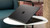 Refurbished Intel Core i7-1265U Processor, 16GB LPDDR4 RAM, 256GB SSD Microsoft Surface Laptop sitting on a round white table in front