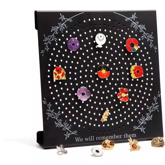 MagnaBadge Display Stand The MagnaBadge™ Display Stand is the perfect way to show off your collection of commemorative badges. This steel stand can hold our exclusive MagnaBadge™ magnetic badges as well as traditional pin