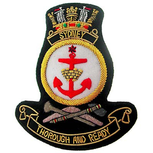HMAS Sydney Bullion badge Superb HMAS Sydney Bullion Pocket Badge perfect for your Blazer, bag or where you want a stylish badge, order now from the military specialists. Approximate size 80x80mm. Securely fastens with 3 butte