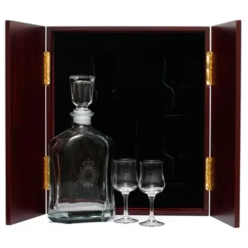 RAAMC Decanter & Glasses in Display Case This (RAAMC) Decanter in Display Case with Glasses, is the perfect gift, order it now from Military Shop. the beautiful two door timber finish display case with Army crest handles measures 320mm wide
