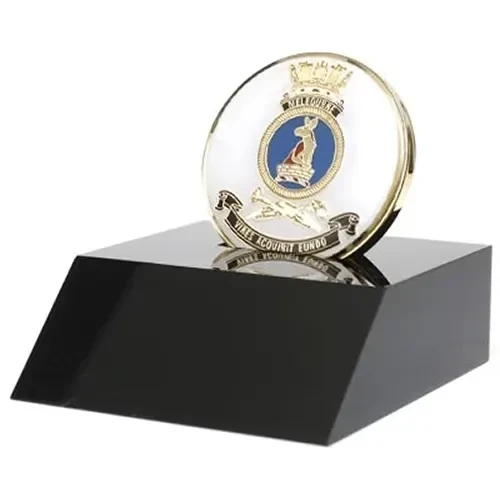HMAS Melbourne Medallion In Stand Superb HMAS Melbourne 48mm medallion presented in a black acrylic stand. Order now, the block is presented in a form cut gift box making it perfect for awards, presentations or that special gift. Spec