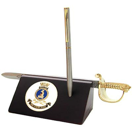 HMAS Melbourne Sword Desk Set HMAS Melbourne Medallion in a stylish acrylic desk stand with a quality pen and Navy sword letter opener.  Presented in a silver gift box with a clear lid, this is the perfect gift to put on the desk