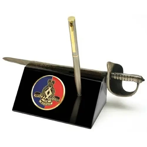 RMC Sword Desk Set Royal Military College Corps of Staff Cadets (RMC) Medallion in a stylish acrylic desk stand with a quality pen and Army sword letter opener.  Presented in a silver gift box with a clear lid, this is