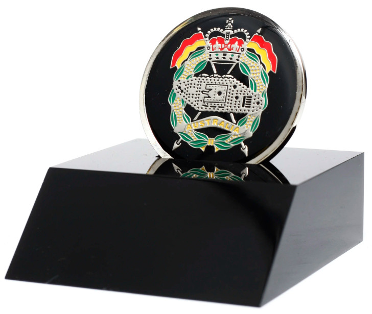 RAAC Medallion In Stand A fantastic Royal Australian Artillery (RAA) medallion presented in a black acrylic desk stand. The stand allows the medallion to sit freely and is presented in a form cut gift box, making it perfect