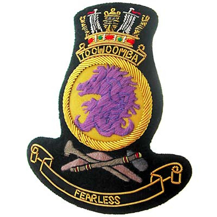 HMAS Toowoomba Bullion badge HMAS Toowoomba Bullion badge Superb HMAS Toowoomba Bullion Pocket Badge perfect for your Blazer, bag or where you want a stylish badge, order now from the military specialists. Approximate size 80x80mm. Securely fastens with 3 bu