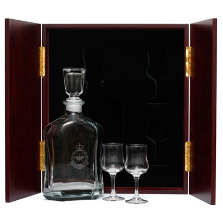 AACC Decanter & Glasses in Display Case AACC Decanter & Glasses in Display Case This (AACC) Decanter in Display Case with Glasses, is the perfect gift, order it now from Military Shop. the beautiful two door timber finish display case with Army crest handles measures 320mm wide x