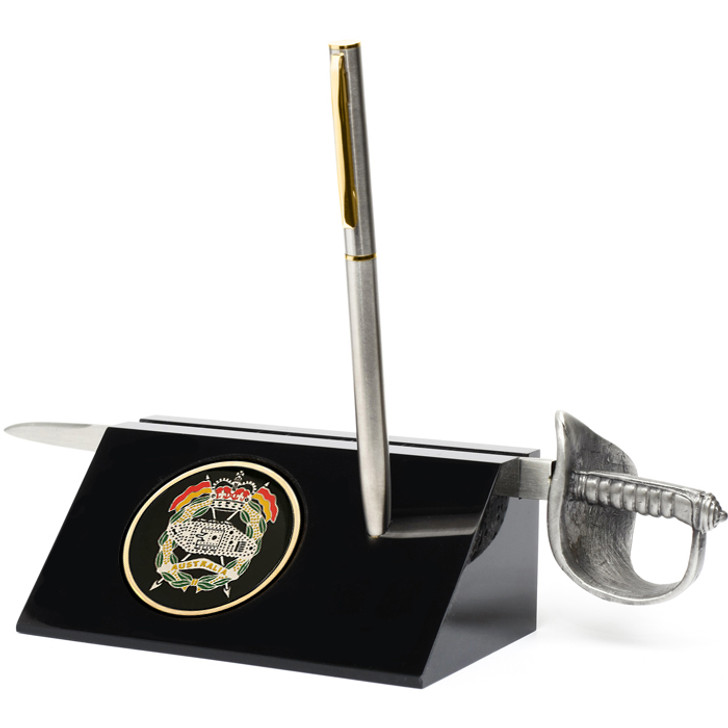 RAAC Sword Desk Set RAAC Sword Desk Set RAAC Medallion in a stylish acrylic desk stand with a quality pen and Army sword letter opener. Presented in a silver gift box with a clear lid, this is the perfect gift to put on the desk at w