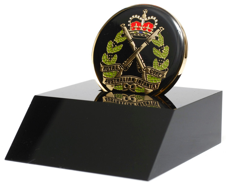 RAinf Medallion In Stand A wonderful Royal Australian Infantry Corps (RAinf) medallion presented in a black acrylic desk stand. The stand allows the medallion to sit freely and is presented in a form cut gift box, making it p