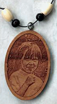 Wood pendant engraved with a photograph.