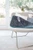 Almohadilla térmica Beurer HK-123 XXL Nordic con mando sobre un sillón
