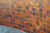 Fired hammered copper tile on outside wall Fired hammered copper tile on outside wall