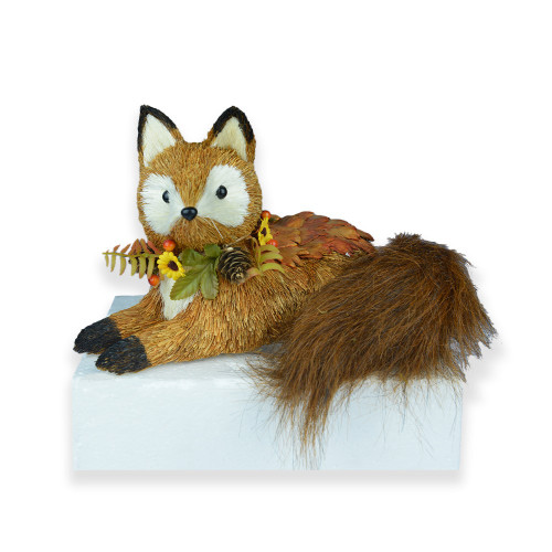 Fox lying down with acorns 29x20x18cm