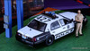 Ford Crown Victoria Las Vegas Metropolitan Police Department (LVMPD) w/Figure & Diorama 1:64 Diecast Model Car by Rollin