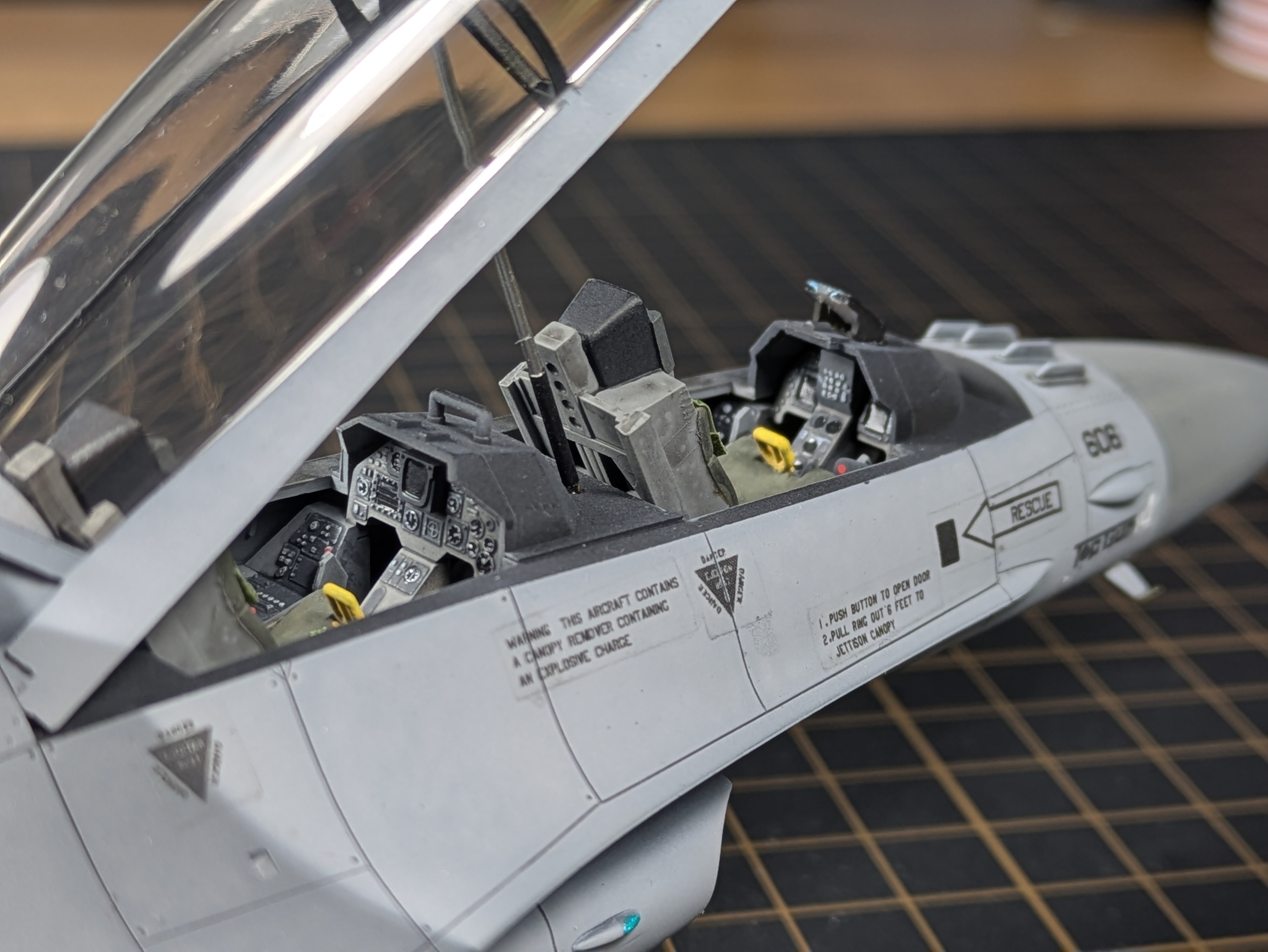 Close-up of cockpit right side showing ejection handles and console