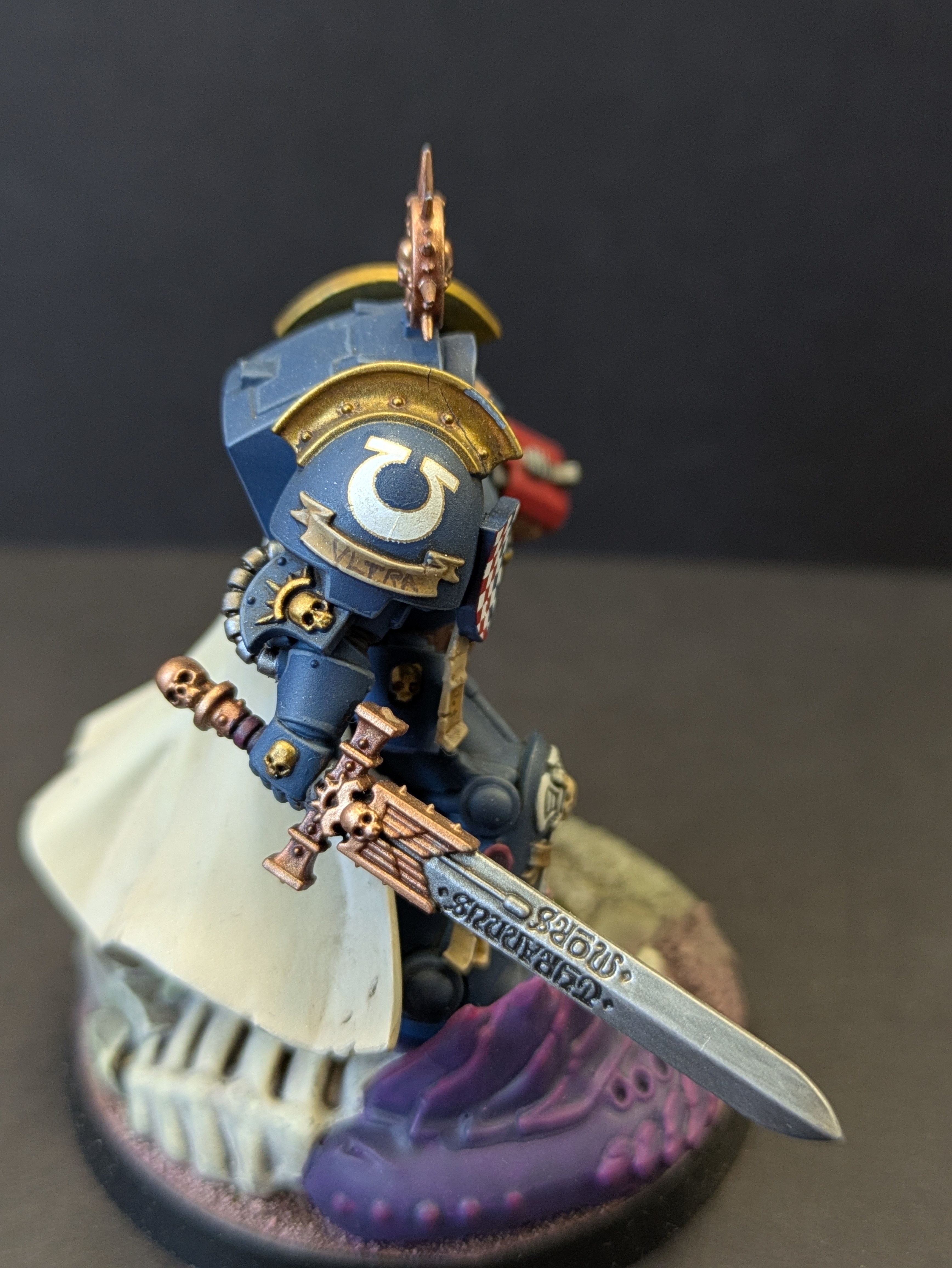 Shoulder detail - decal, gold trim, parchment