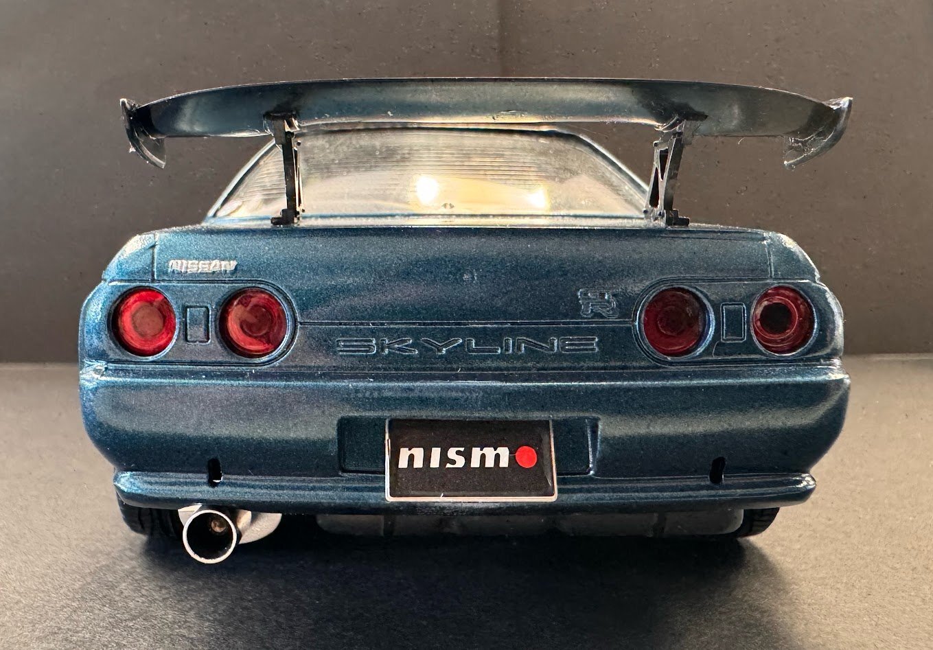 Rear straight on - GT-R badge, license plate, exhaust