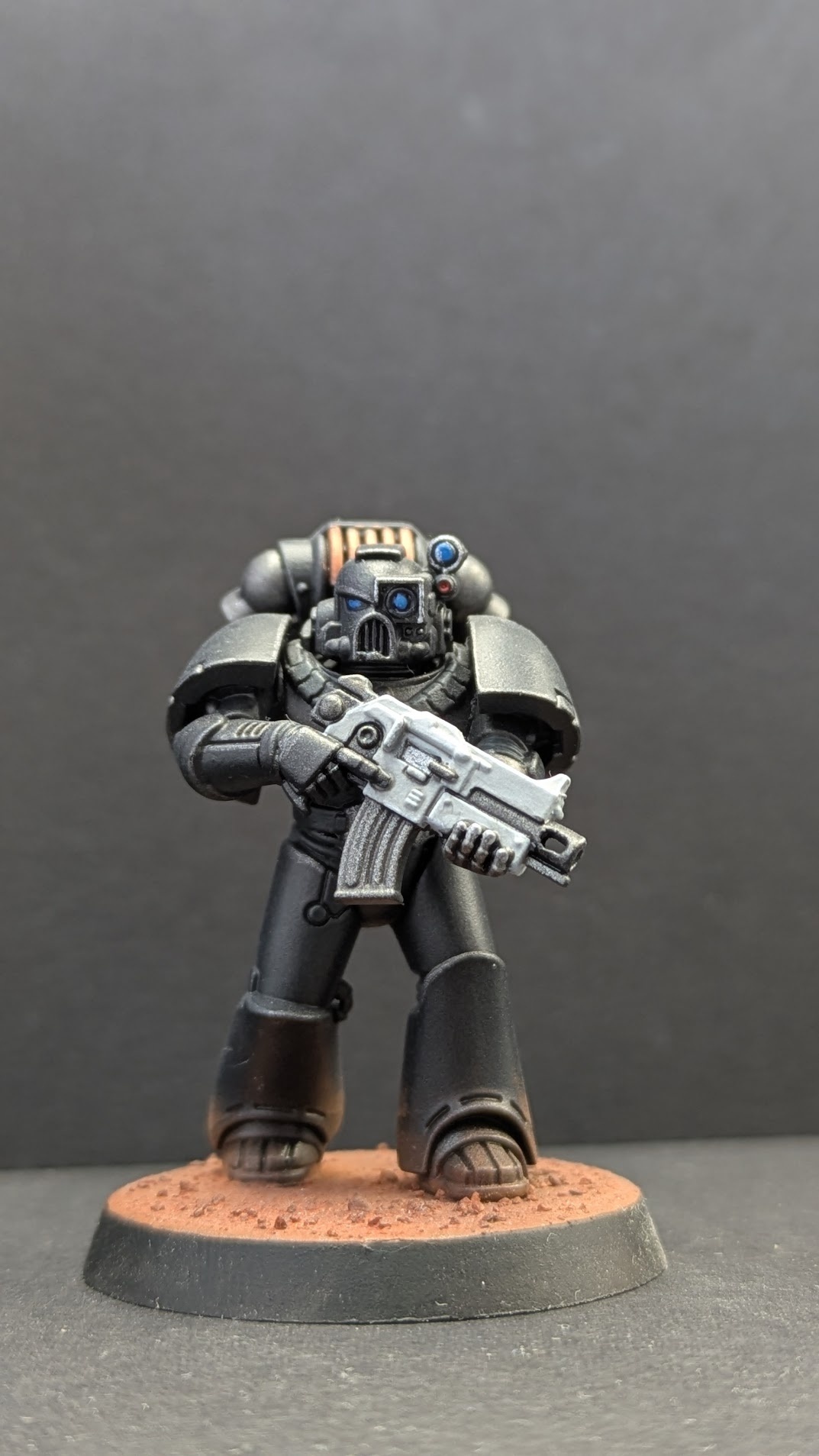 Close-up of walking Iron Warrior showing eyes, attachments and white weapon casing
