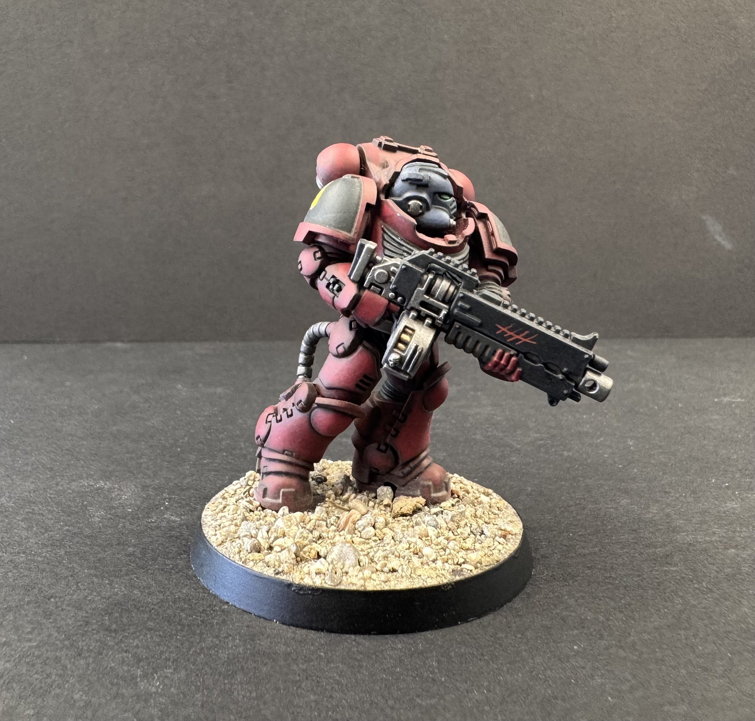 Side profile showing armour panel transitions and weapon detail