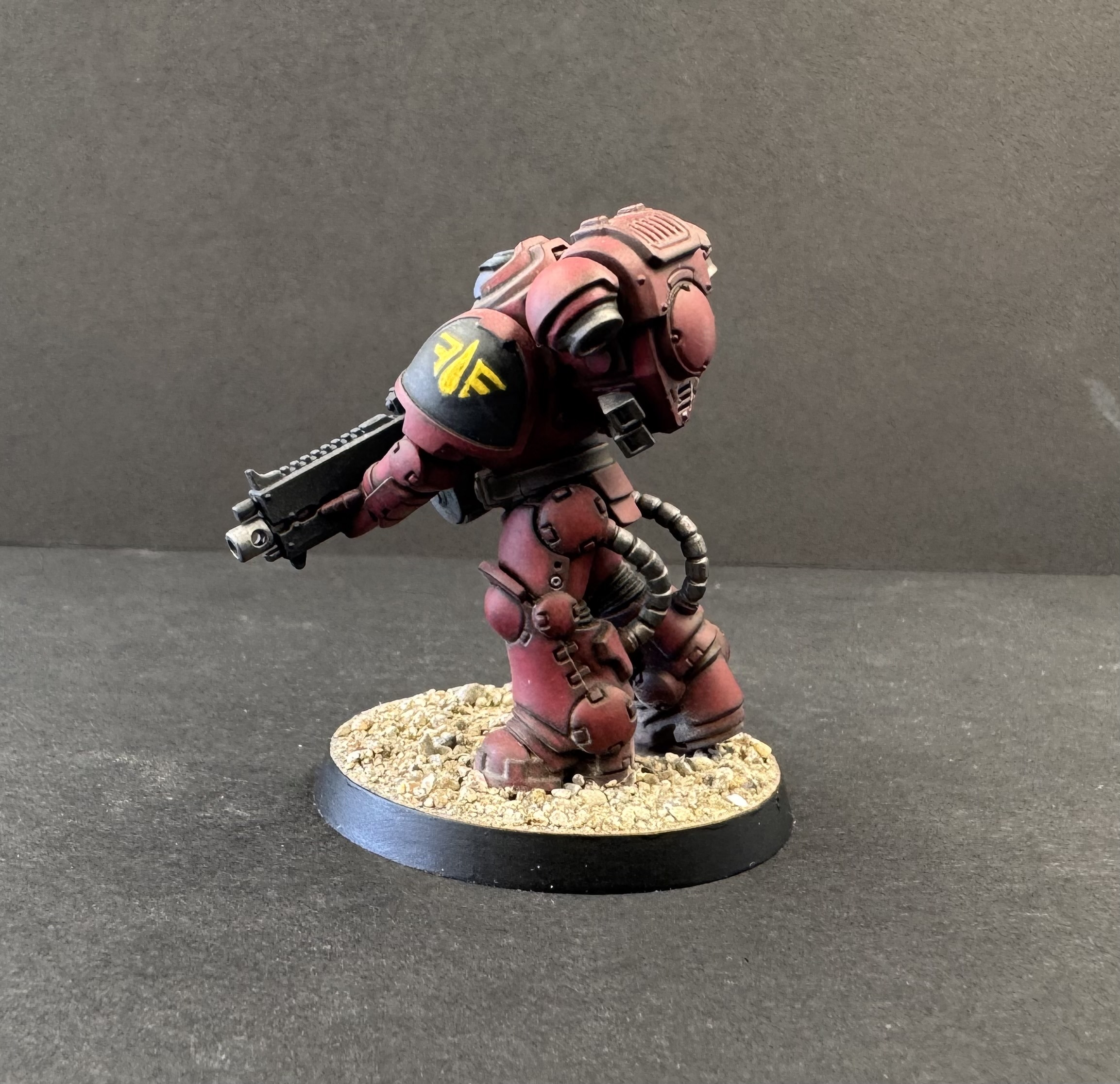 Side profile showing freehand left shoulder pad symbol