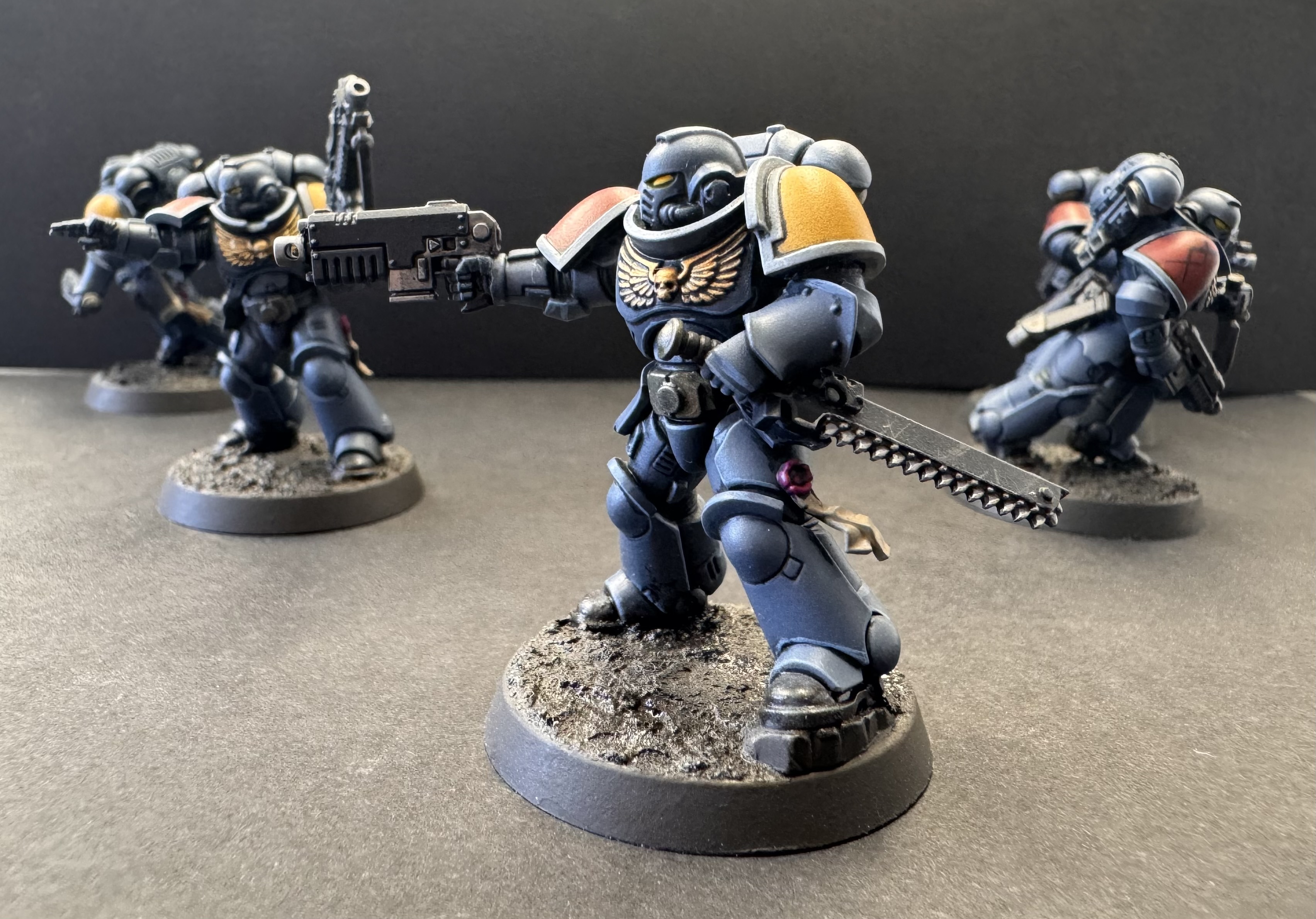 Front right of dualist showing chest symbol, weapon and eye detail