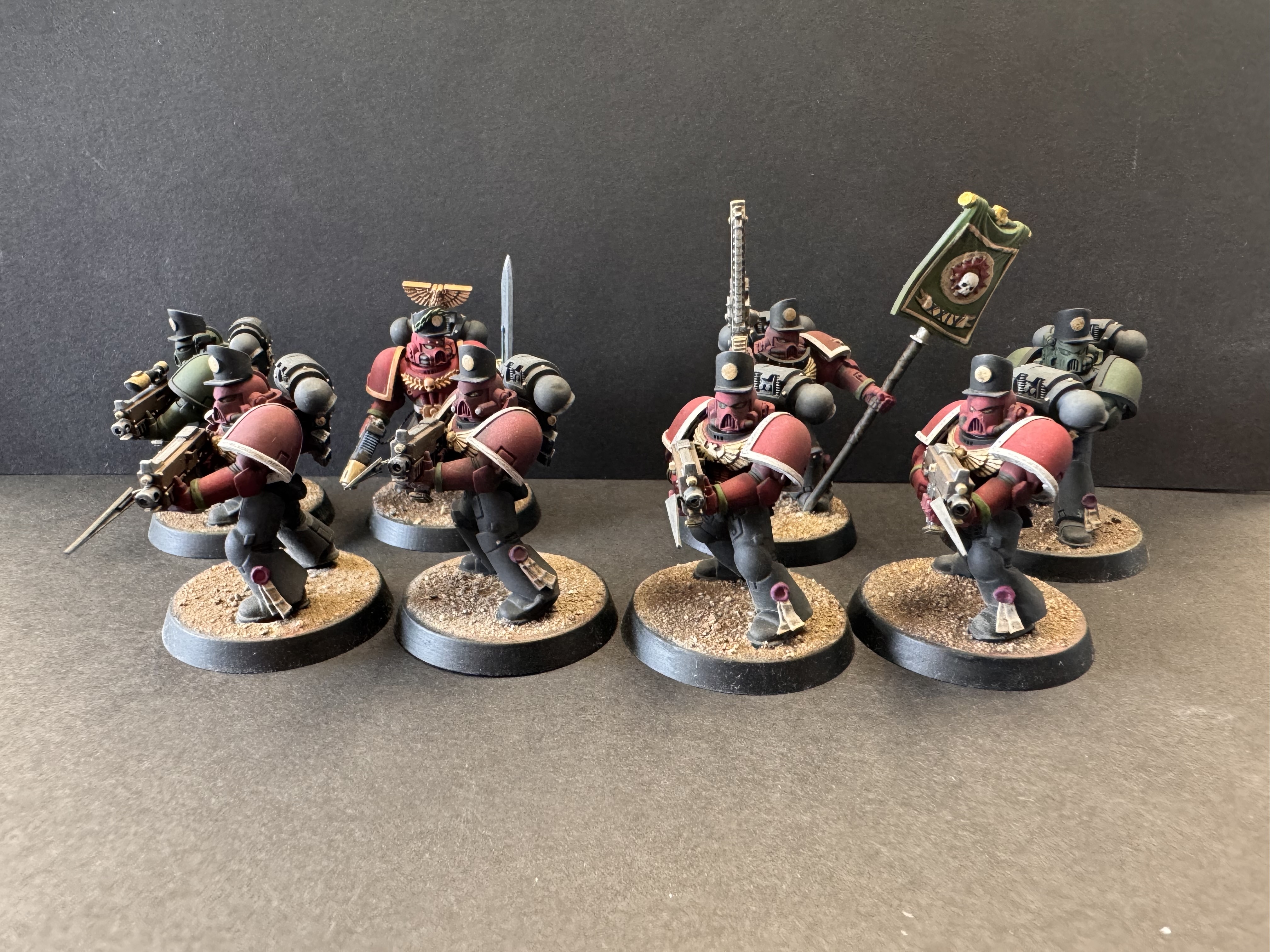 Royal Marines hero image - four red coats at front, lieutenant and sergeant leading from the back with riflemen