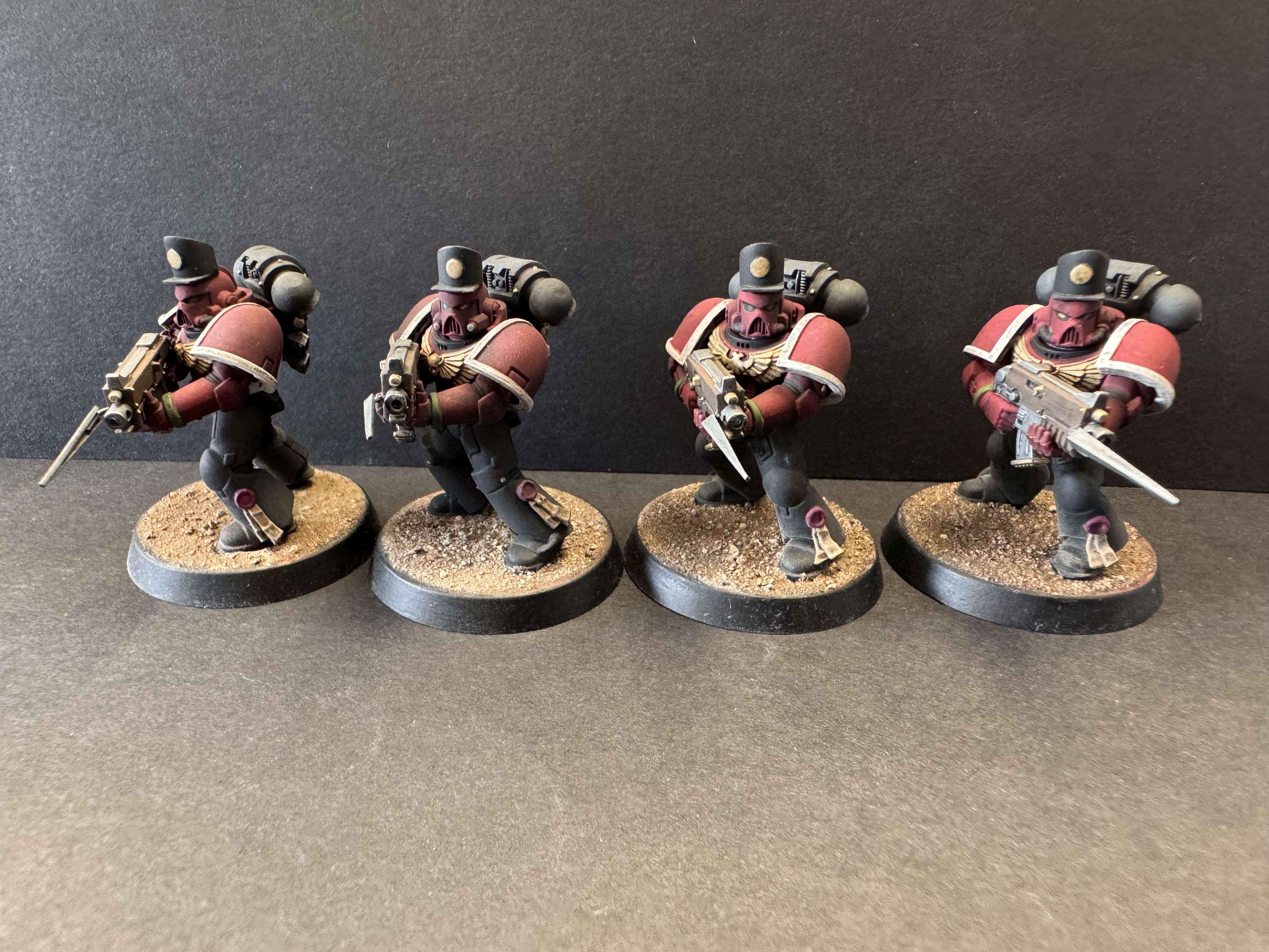 Front pose - four red coats