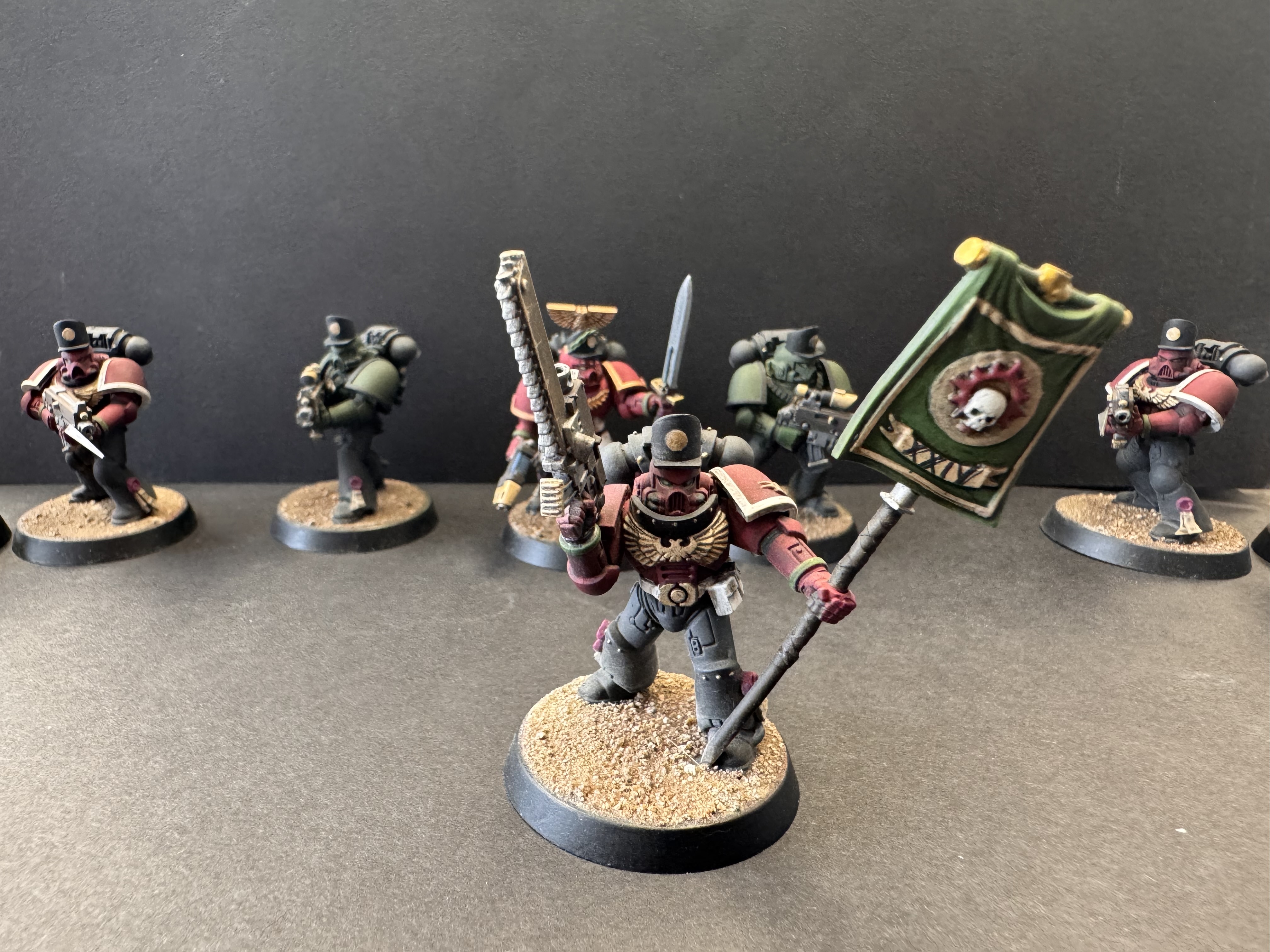 Sergeant close-up - gold trim, eyes and squad in background