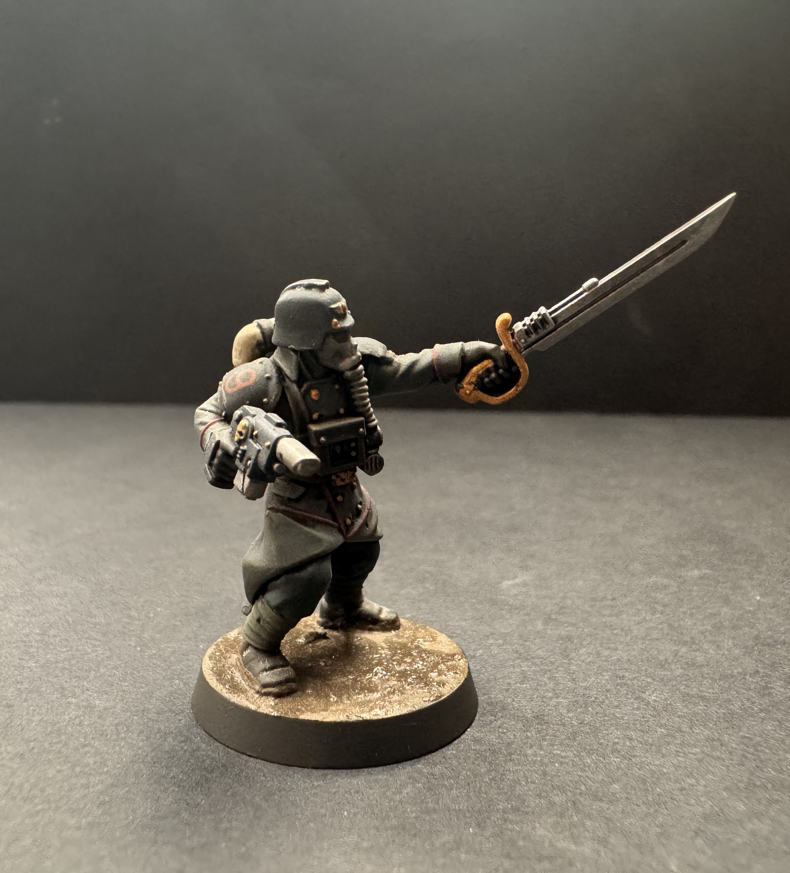 Krieger hero shot - side profile left showing Mauser las pistol and red 9 shoulder decal