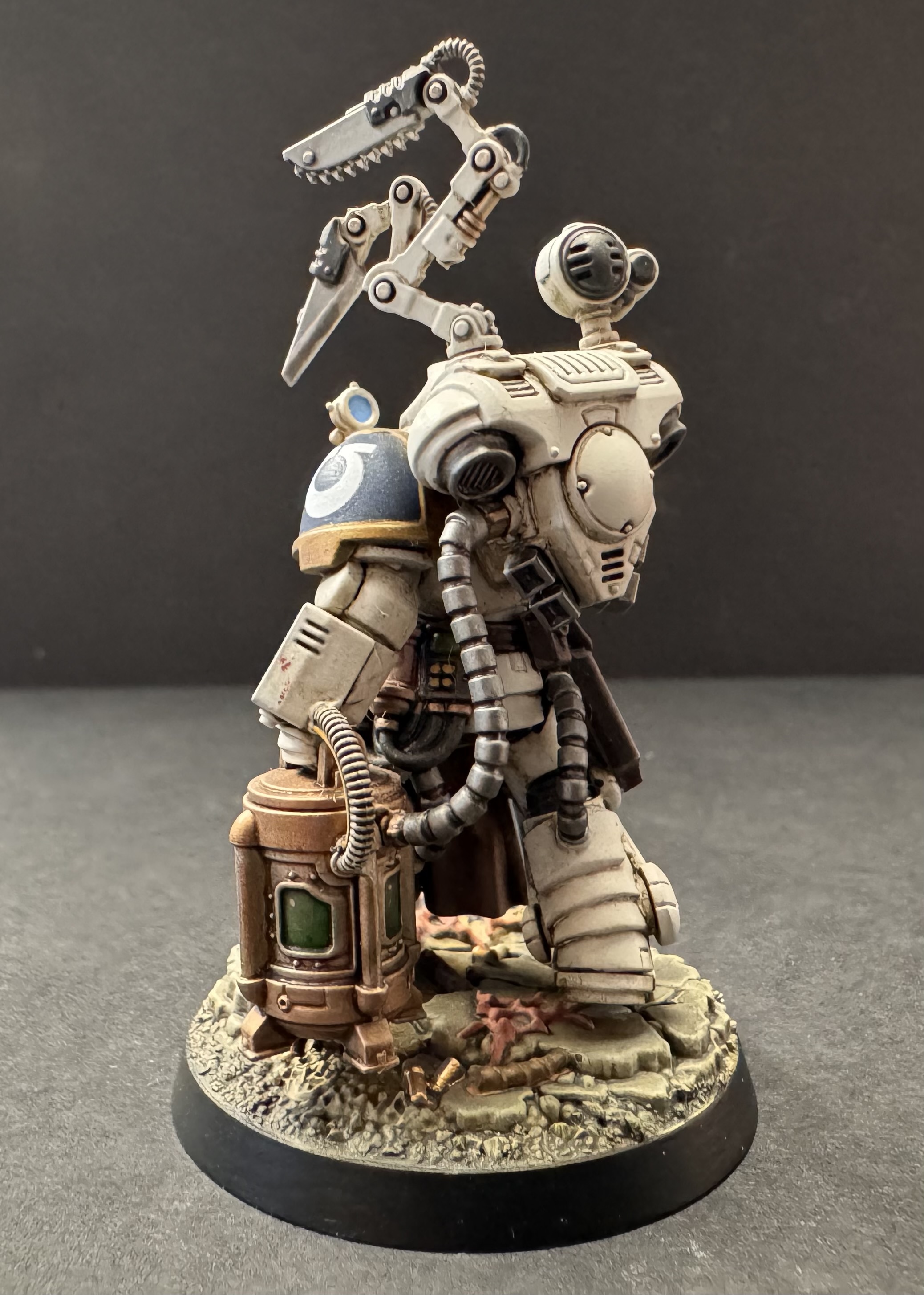 Back three-quarter left - backpack, armored wires and canister