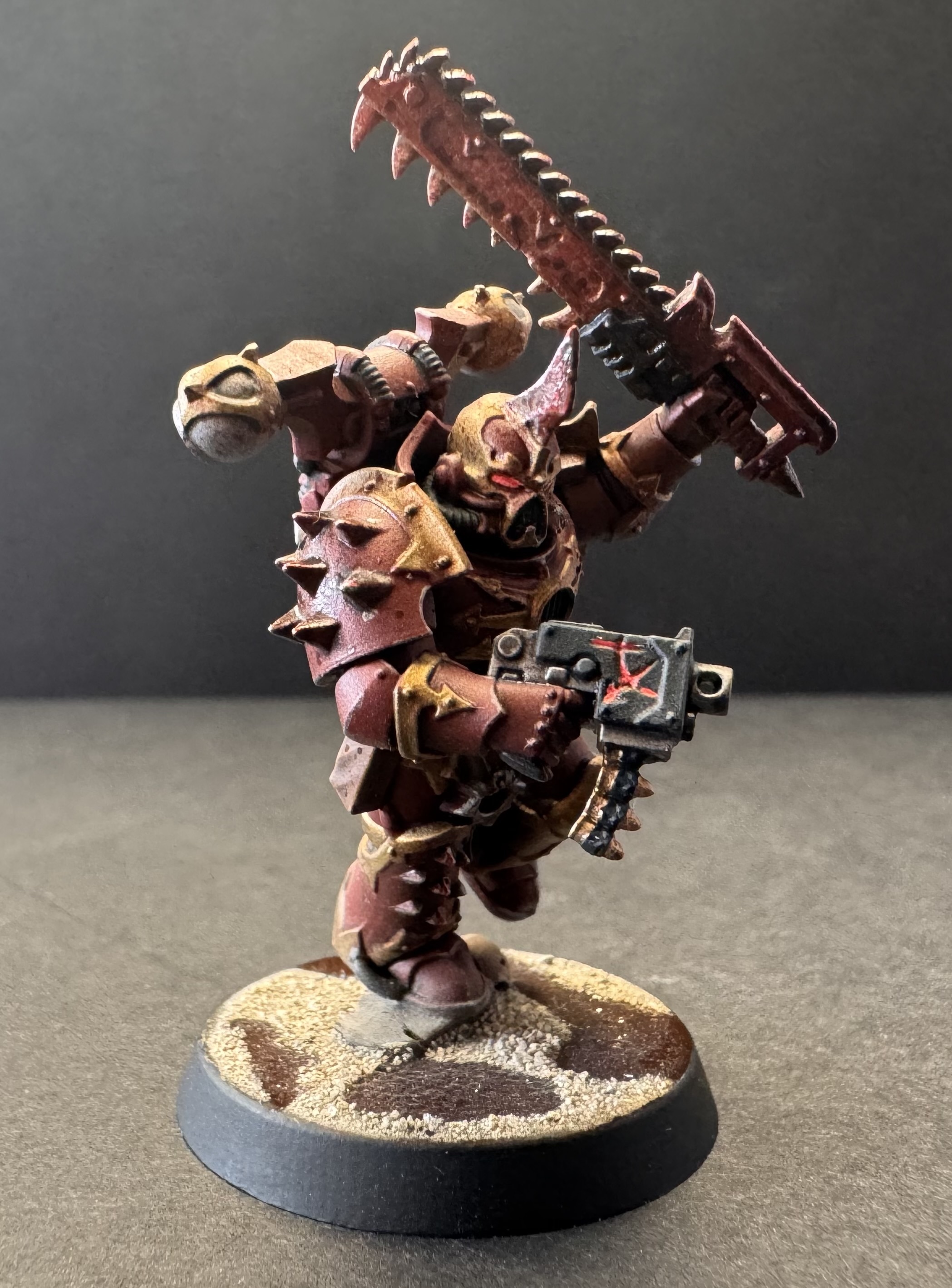 Three-quarter right - bolt pistol symbol glow and gory shoulder spikes