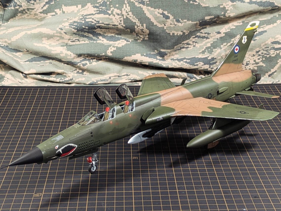 F-105G three-quarter front with reference books and Wild Weasel badge