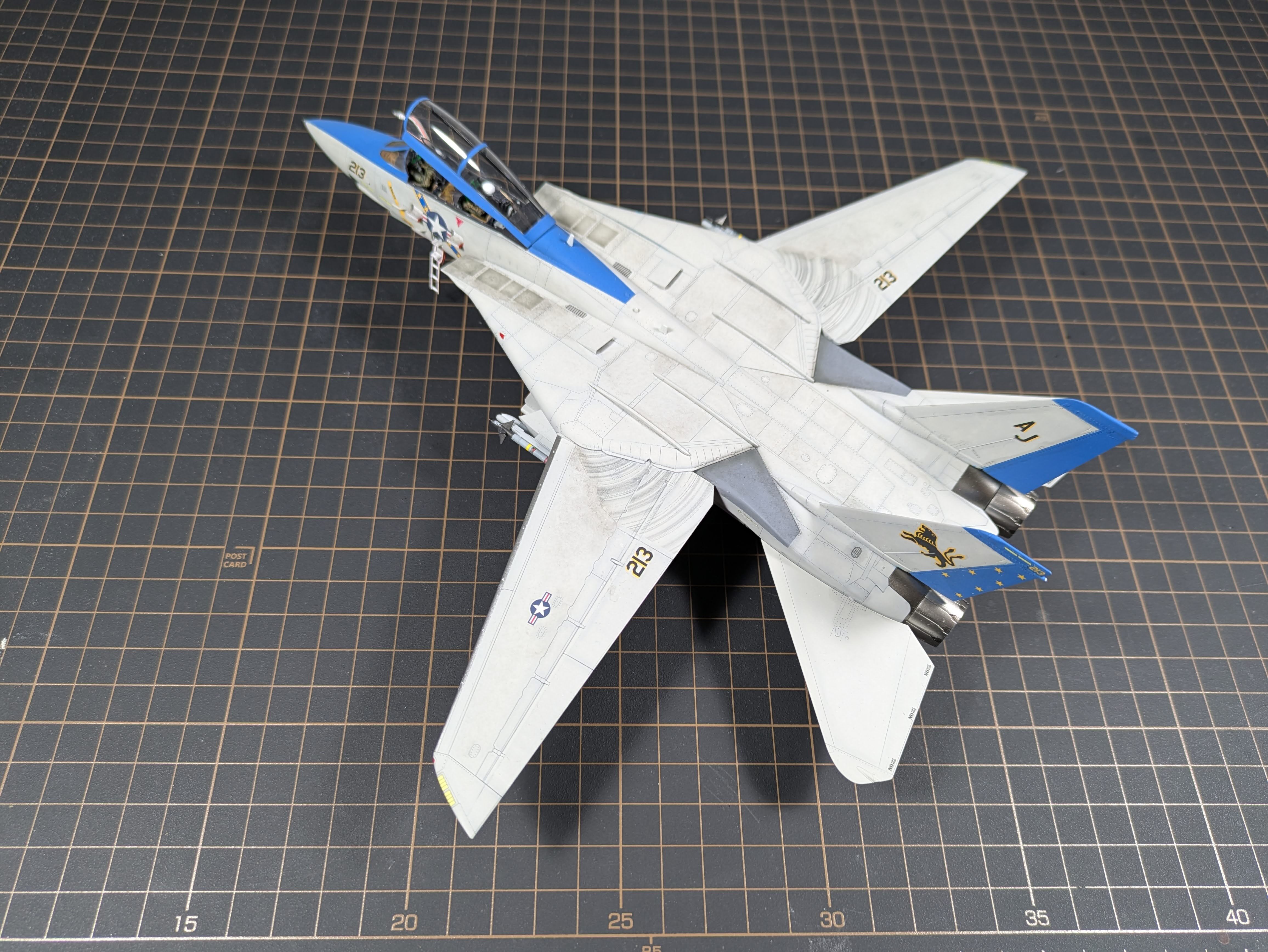 Three-quarter nose view showing blue nose and open cockpit
