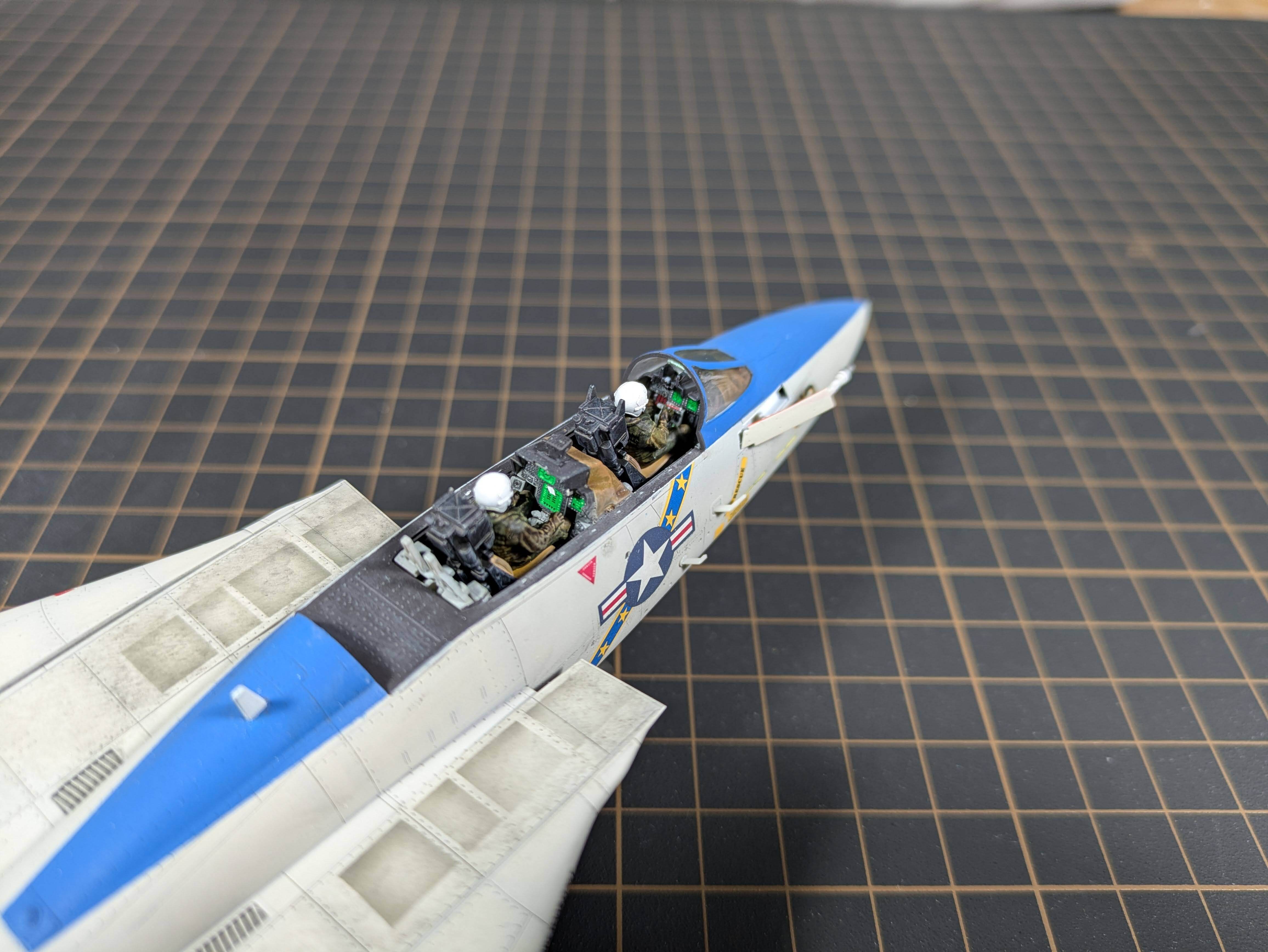 Top-down view of both pilots seated showing paint detail