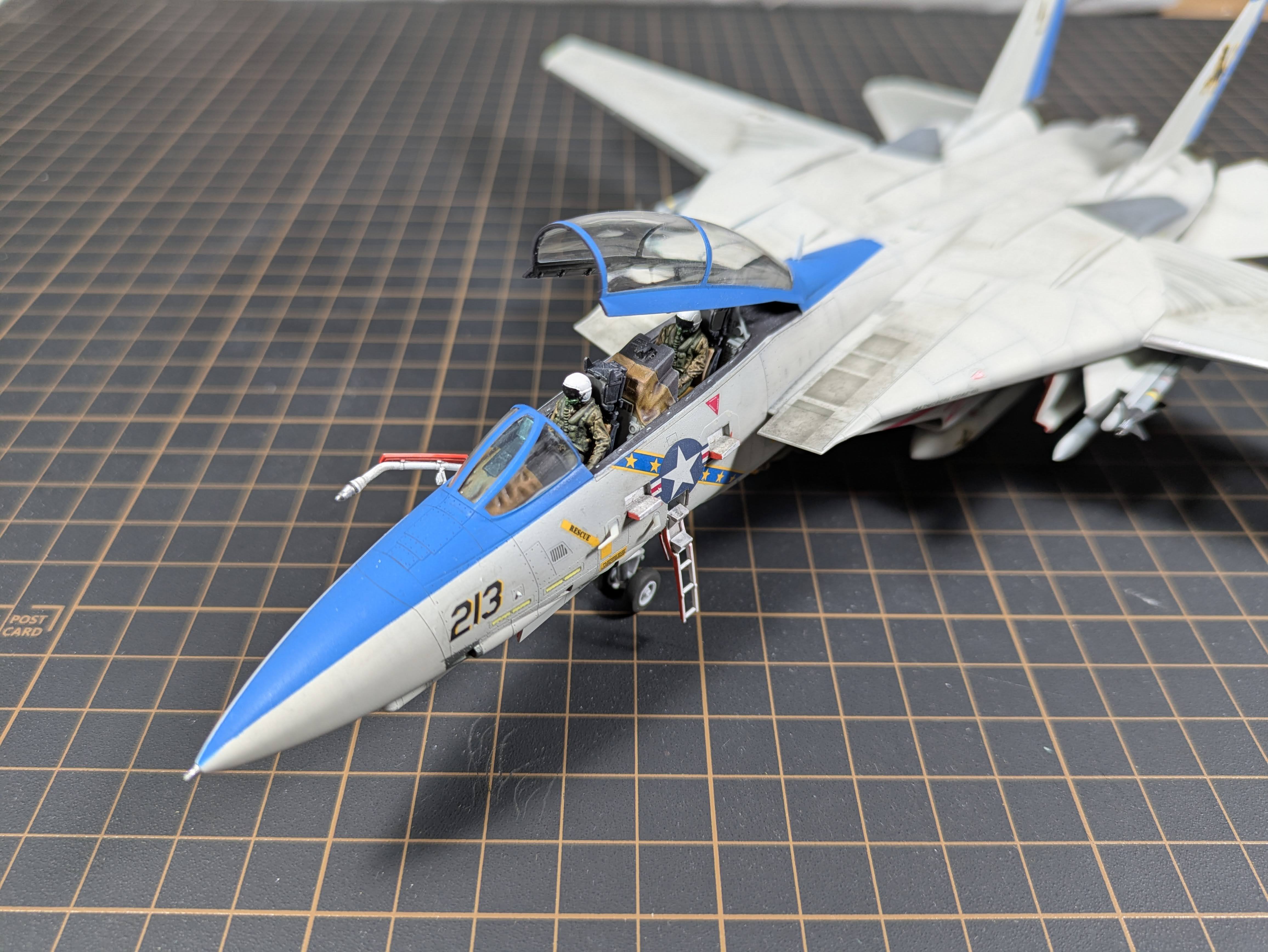 F-14D front quarter with pilots visible in open cockpit