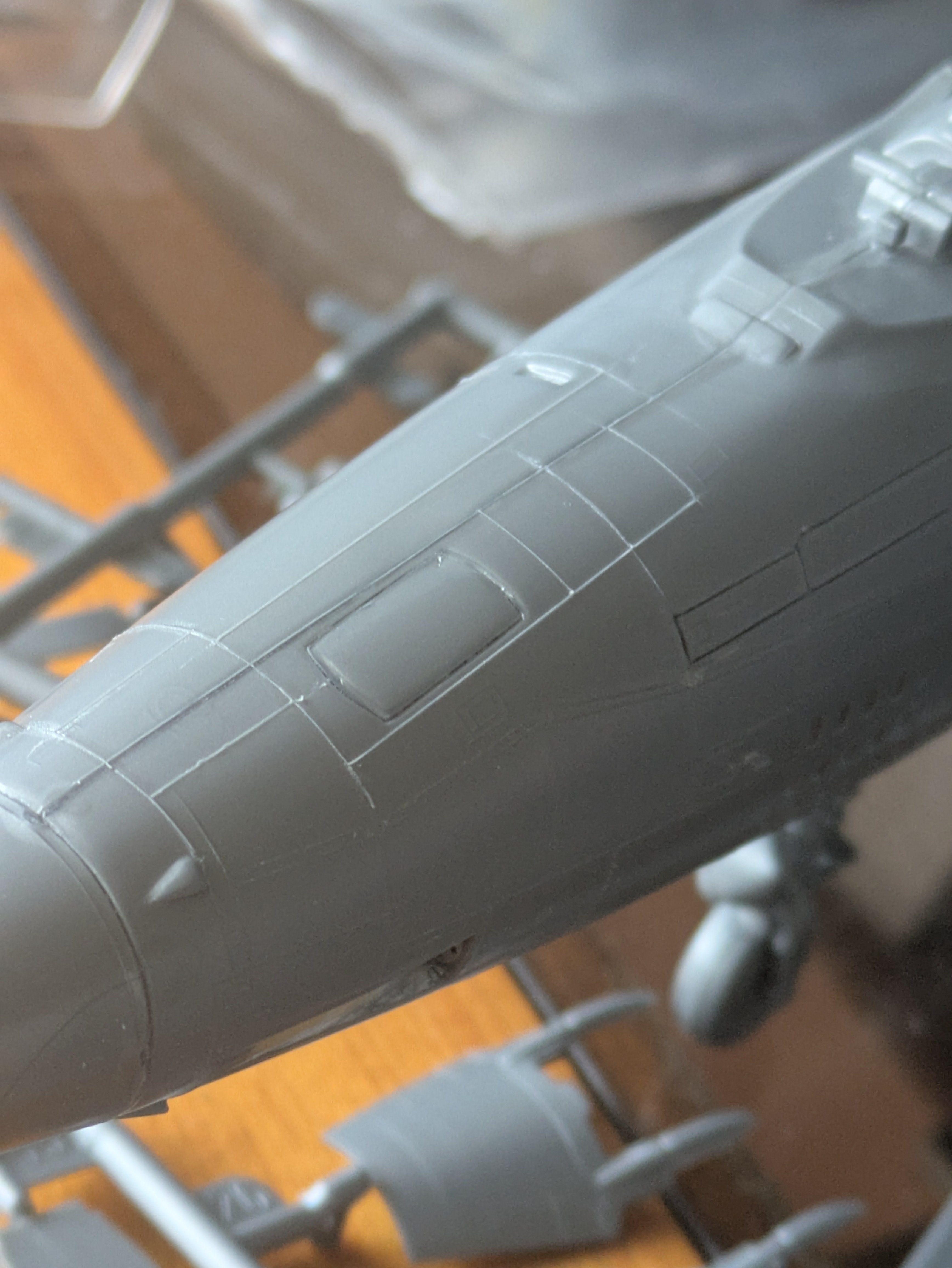 Stretched sprue panel lines being restored on the F-105G fuselage