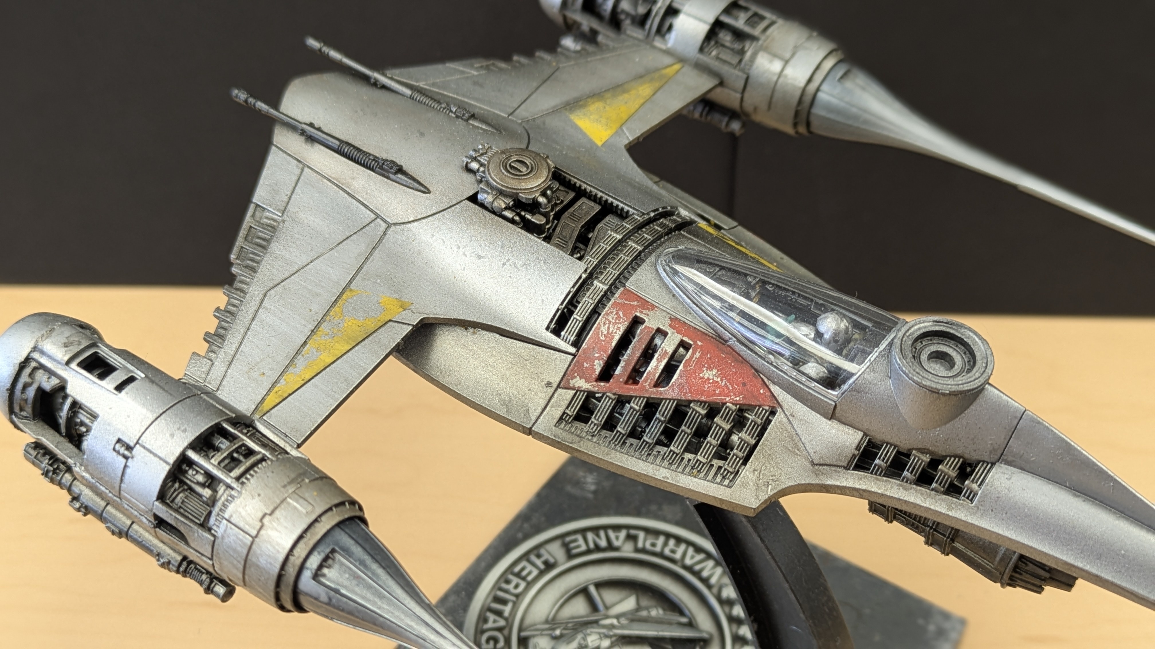 N-1 Starfighter fuselage detail showing cockpit, red panel and Mandalorian figure