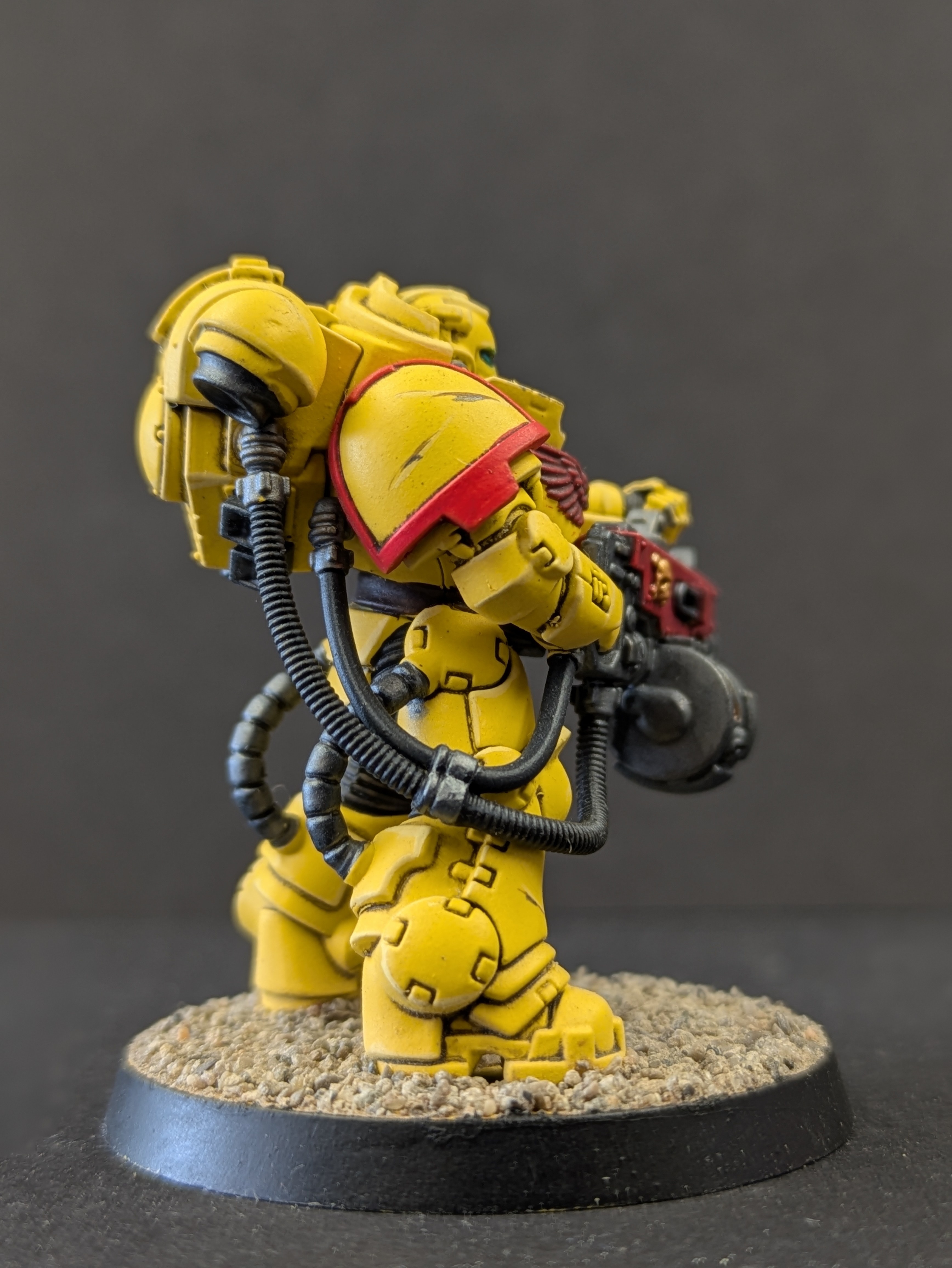Back view showcasing weapon and power cables