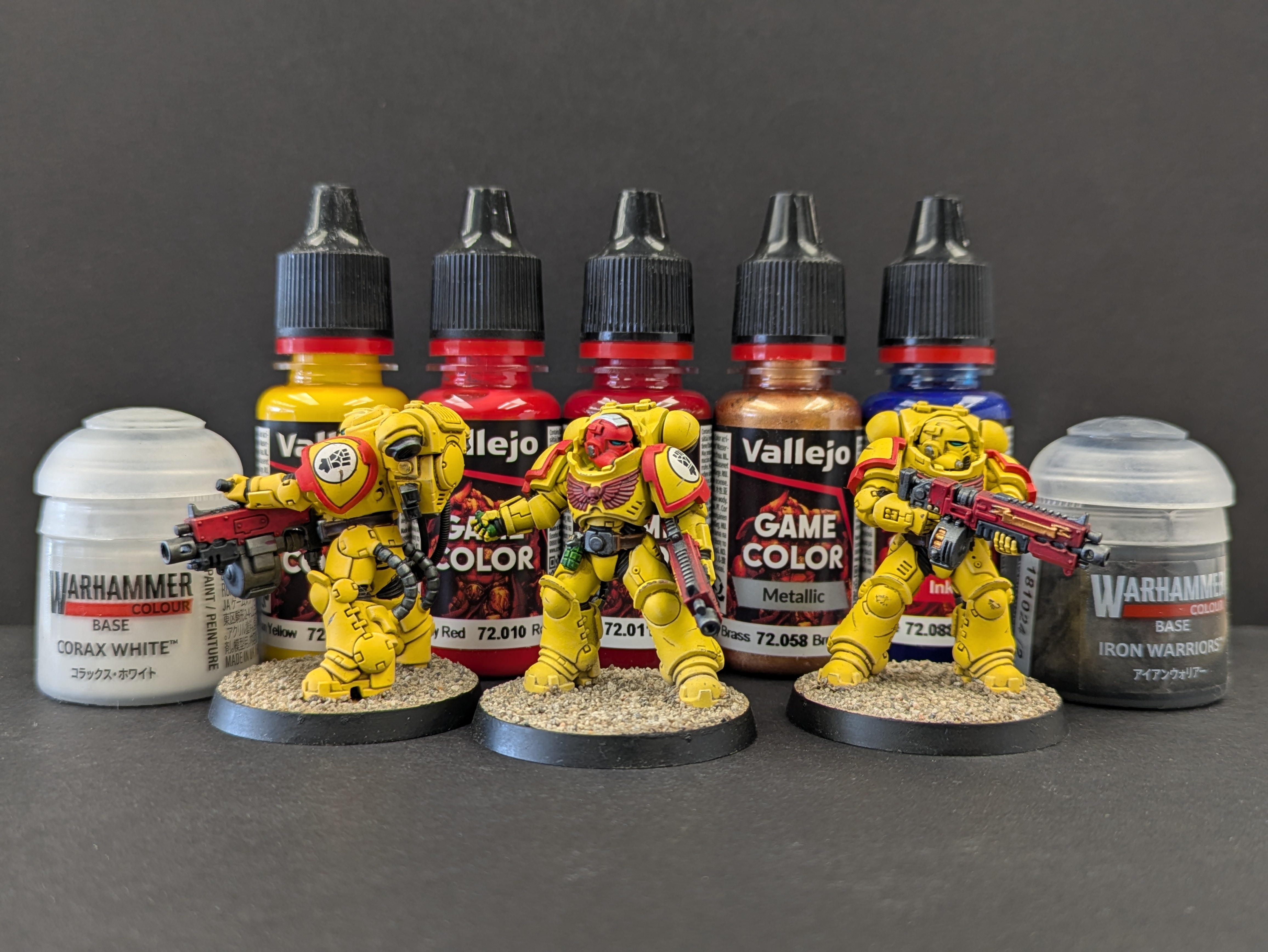 Imperial Fists squad with essential paints in background