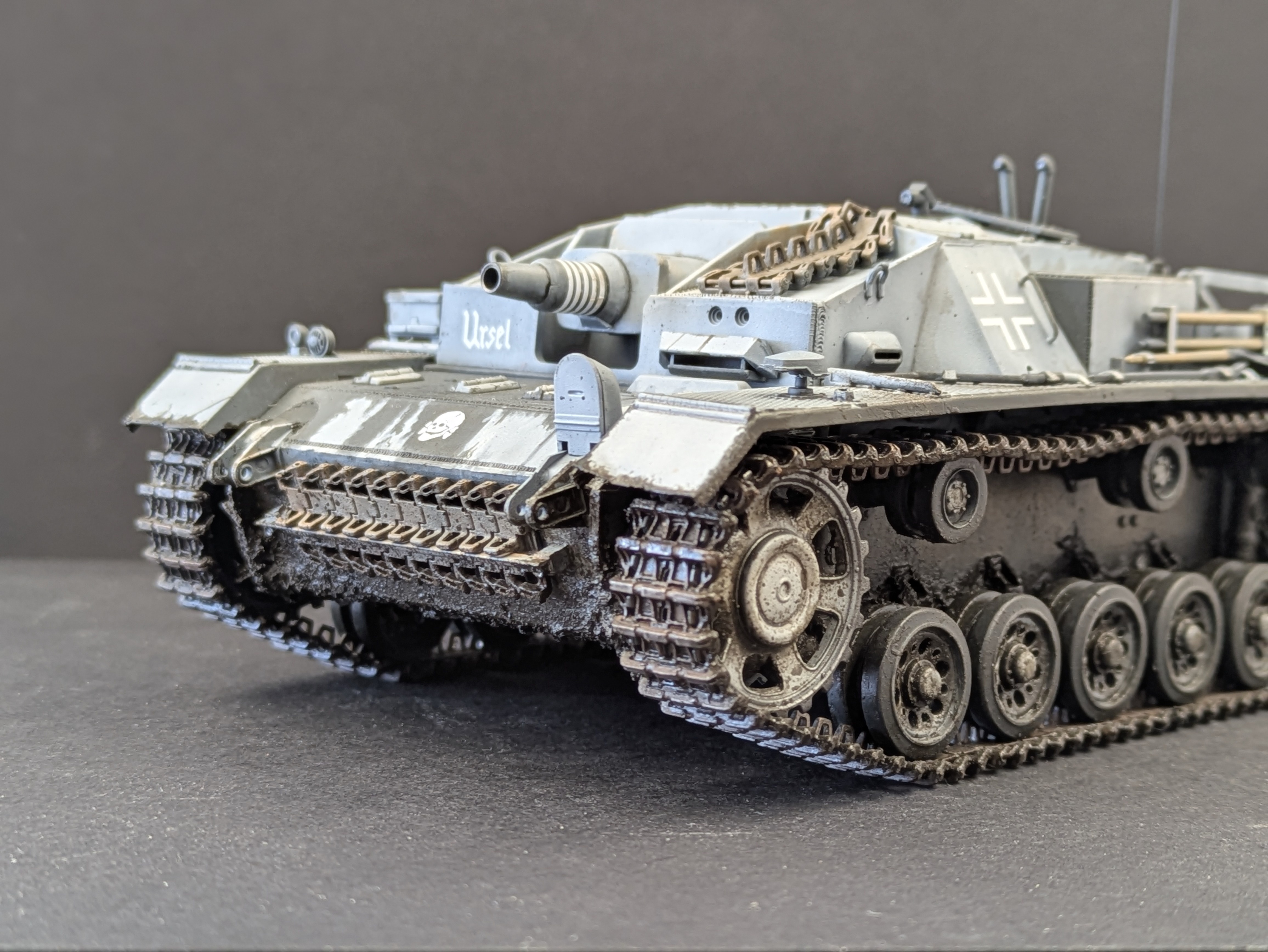 Close-up front left showing weathering on spare tracks