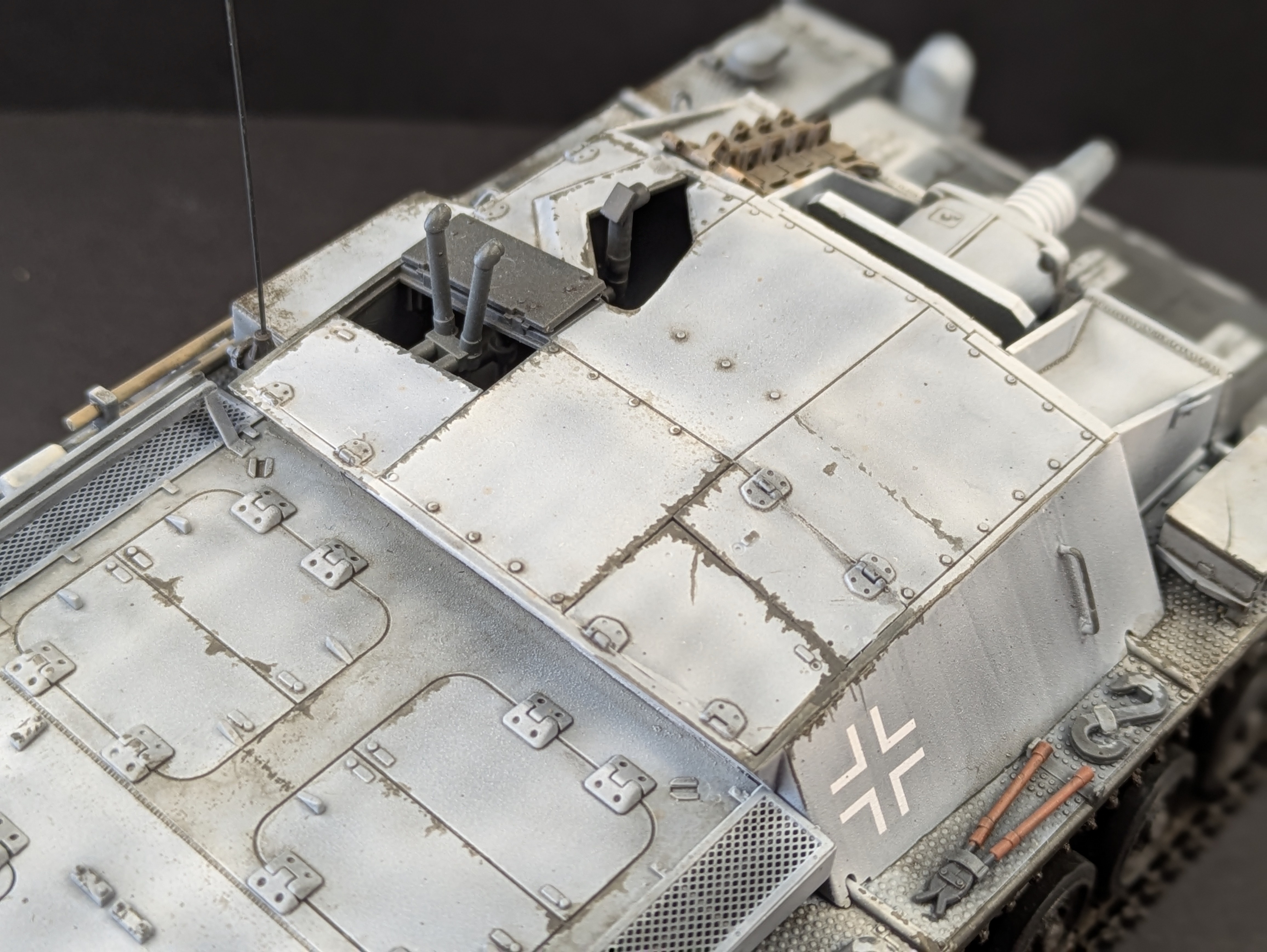 Top close-up showing manual chipping and wear on turret access hatches