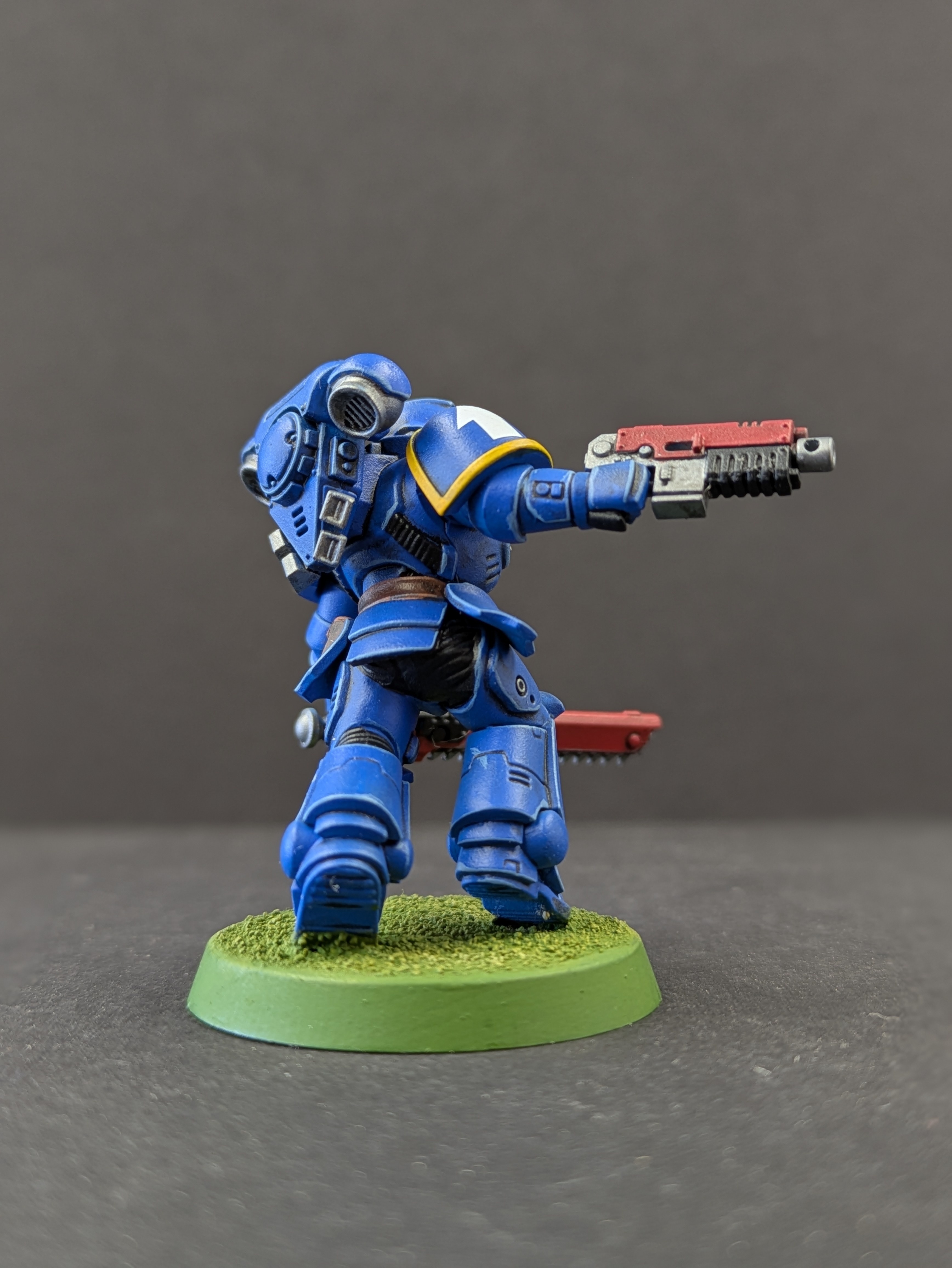 Back view showing bolter and backpack