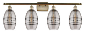 Vaz - 4 Light - 36 inch - Antique Brass - Bath Vanity Light (516-4W-AB-G557-6SM) Vaz - 4 Light - 36 inch - Antique Brass - Bath Vanity Light (516-4W-AB-G557-6SM)