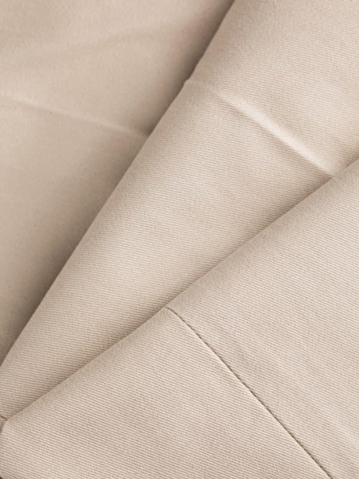 Close Up of Mens Stone White Pleated Chinos Fabric