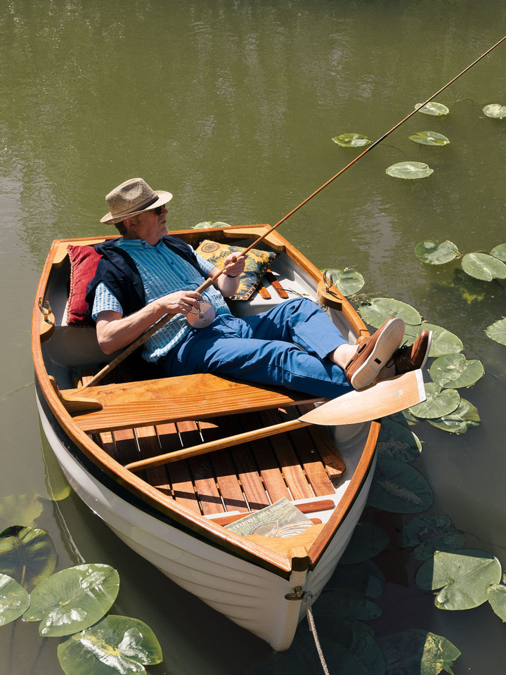 Lord Trousers relaxing in boat on water
