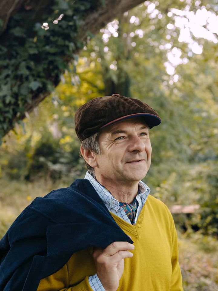 Michael wearing cord baker boy cap
