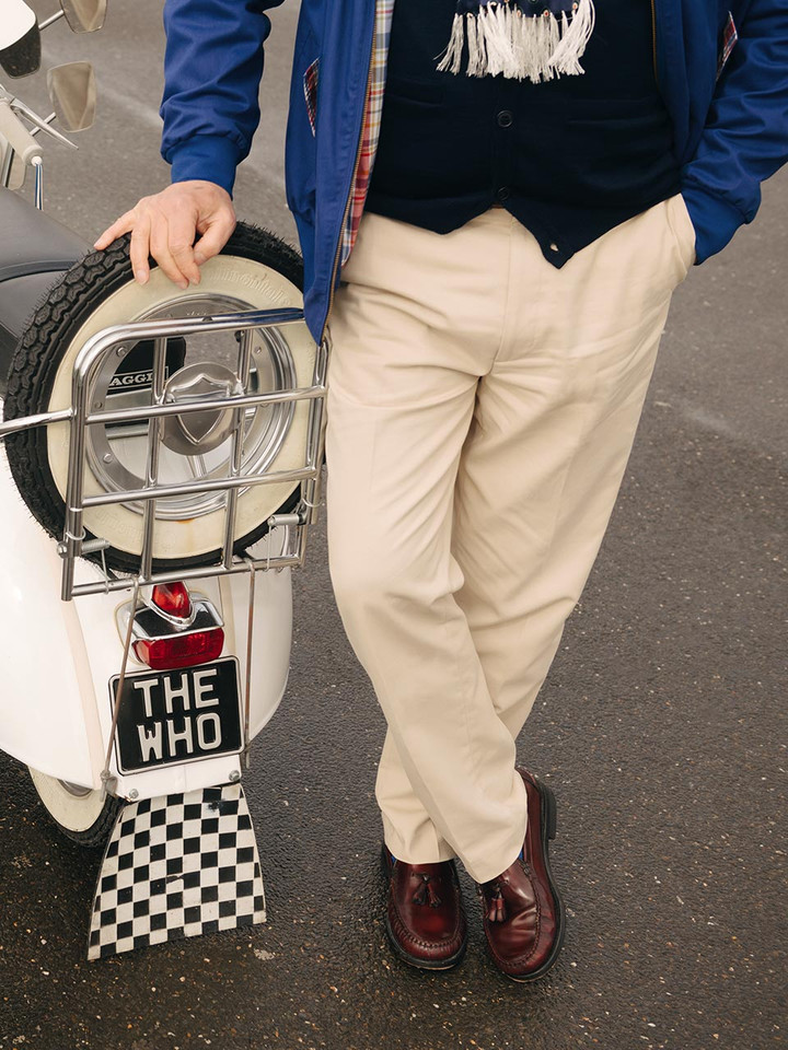 Chino Trousers standing next to The Who 1964 Vespa GS