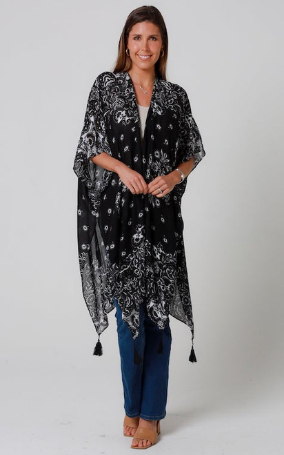 Drape yourself in effortless elegance with our Midnight Bloom Kimono. This beautifully piece features a sophisticated black and white floral paisley print, offering a versatile layer that instantly elevates any outfit. Crafted from a lightweight, breathable fabric, it's perfect for warm-weather styling, adding a touch of bohemian chic over a simple tank and jeans, or as a stylish swimsuit cover-up. The relaxed, open-front design and delicate tassel details at the hem create a graceful silhouette that moves with you. Embrace versatile luxury with this must-have addition to your wardrobe.

Colour: Black

Fabric: Viscose

Size: OSFA