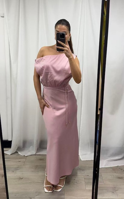 Embrace timeless elegance with our Avril One Shoulder Maxi Dress, your new go-to for sophisticated style. This flowing, satin drapes beautifully, the unique one shoulder design adds a modern, alluring touch, while the adjustable waist tie cinches for a flattering fit that highlights your curves. Its versatile maxi length makes it perfect for a variety of occasions – from sun-drenched garden parties and elegant daytime events to sophisticated evening gatherings and wedding guest attire. Pair with white, strappy heels and a clutch for an elegant evening look!

This dress features:

Asymmetric neckline
One shoulder design
Removable waist tie with gold bead details
Invisible side zip
Fully lined
No stretch in the waist
Maxi length
Colour: Pink

Fabric: 97% Polyester, 3% Elastane; Lining: 97% Polyester, 3% Elastane

Size Guide: True to size.